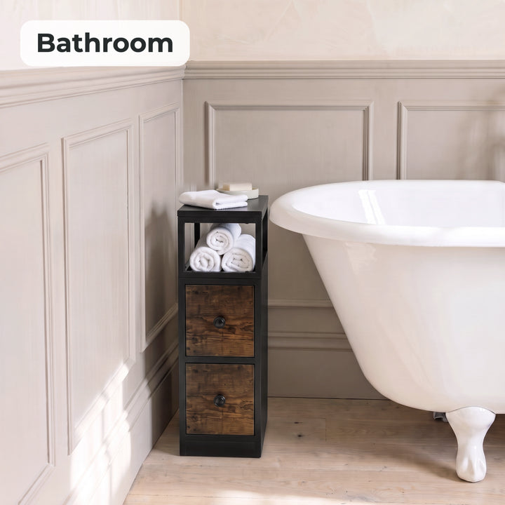 [Black + Rustic] Narrow side table with storage beside a bath, holding towels and toiletries