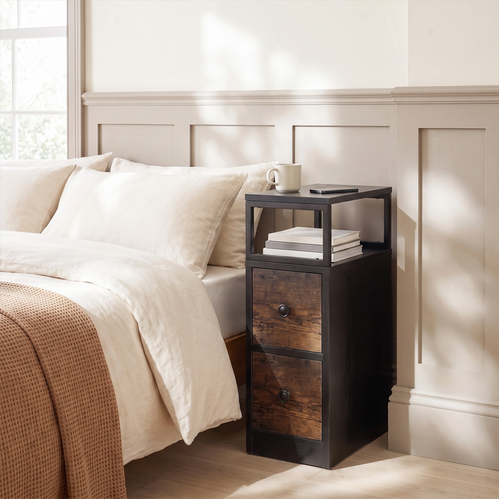 [Black + Rustic] Narrow side table with storage beside a bed, holding a lamp and small bedroom essentials