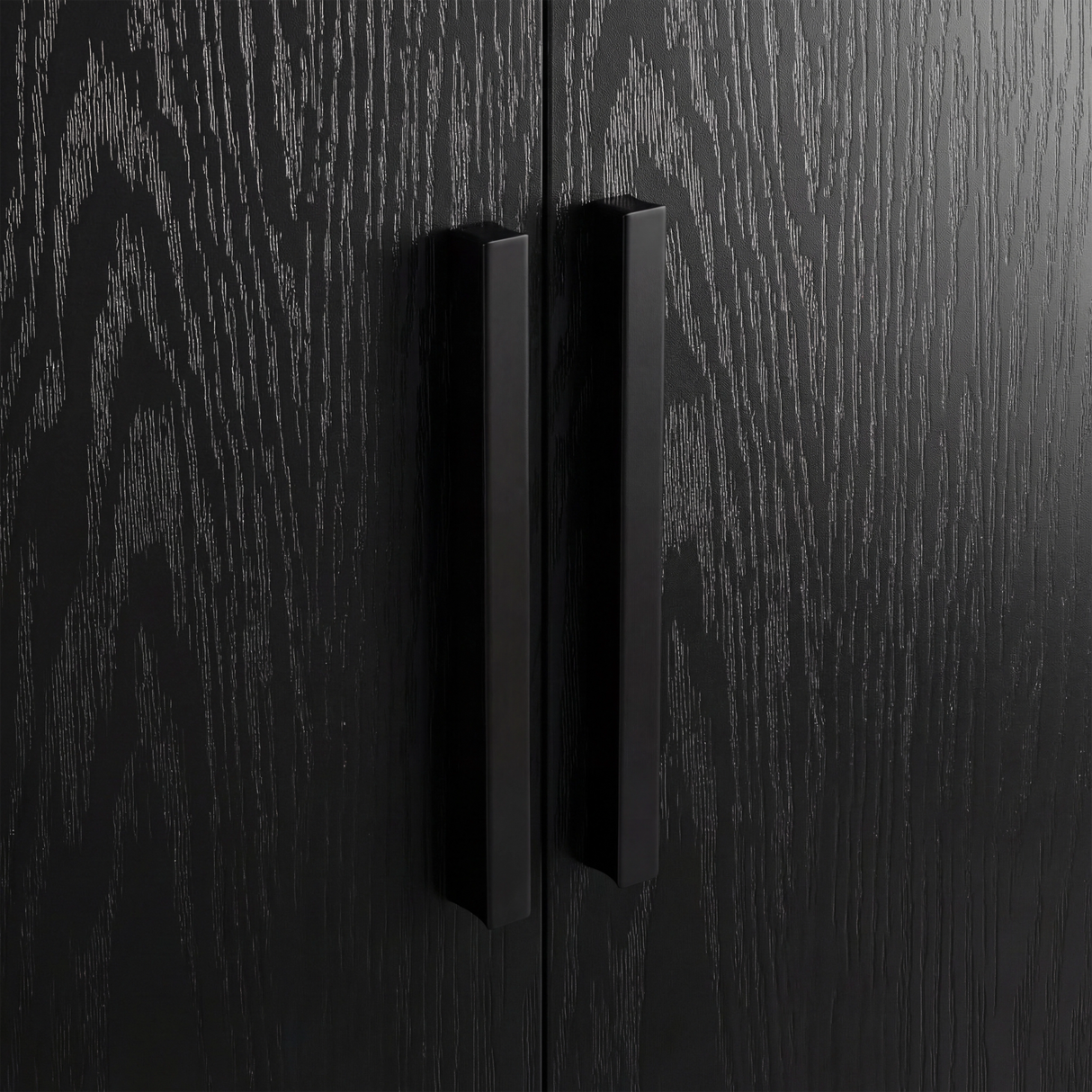[Black] Close view of black wooden vertical handle mounted on textured rustic wood wardrobe door