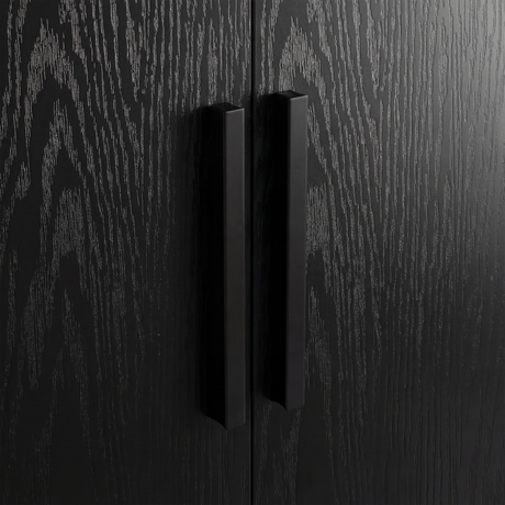 [Black] Close view of black wooden vertical handle mounted on textured rustic wood wardrobe door
