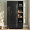 [Black] Selby wardrobe front view with two-door panel, open shelves with folded clothes and accessories, and bottom drawer