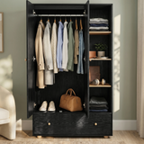 [Black] Selby wardrobe interior open showing hanging rail with clothes, open shelves with accessories, and bottom drawer closed