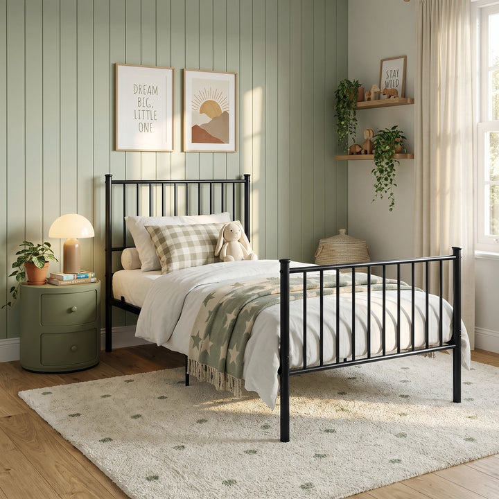 [Black | Single] Wide bedroom scene showing a metal bed, toy bunny, star throw, bedside cabinet, plant shelves, and window.