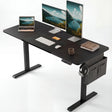 Black Electric Standing Desk with dual monitors, laptop, and accessories. Adjustable height ideal for gaming or office setups.