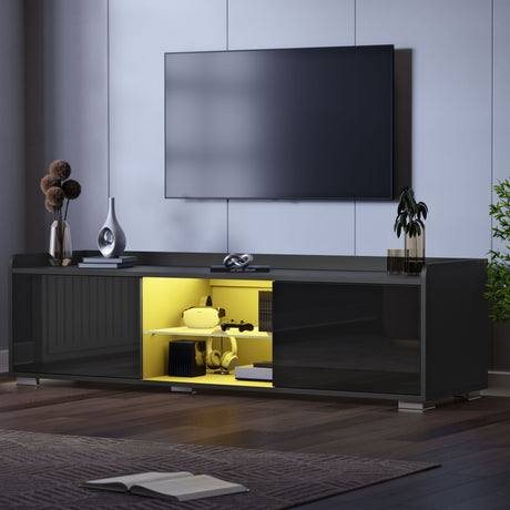 Modern black entertainment console with open door revealing yellow interior, mounted TV above.