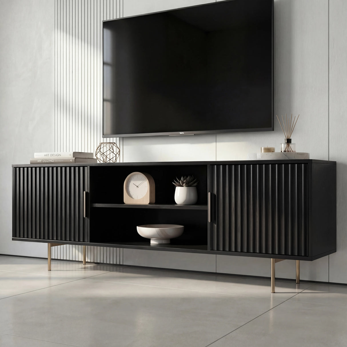 Front view of a modern black TV cabinet with vertical fluted doors, open center shelving, and slim silver legs.