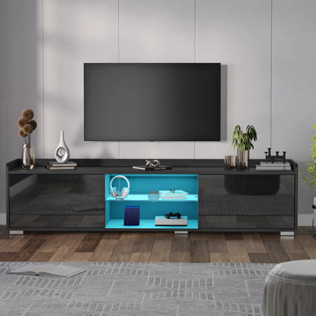 Modern black TV stand with a blue illuminated shelf in a living room setting.