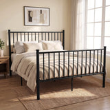 [Black | King] Angled view of metal king bed with white bedding, bar headboard and footboard, centre legs, nightstand & plant