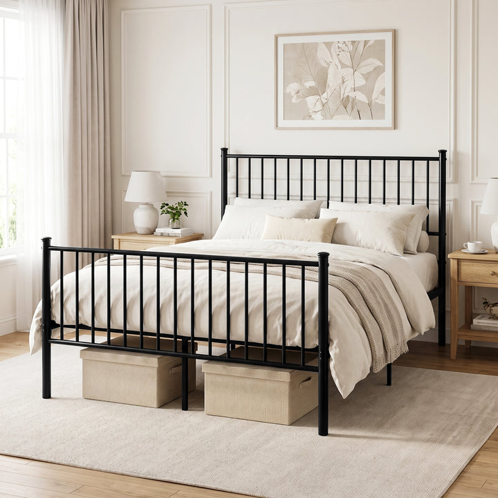 [Black | King] Black metal bed with white bedding, storage boxes, wooden bedside tables, lamps and plants in a bright room.