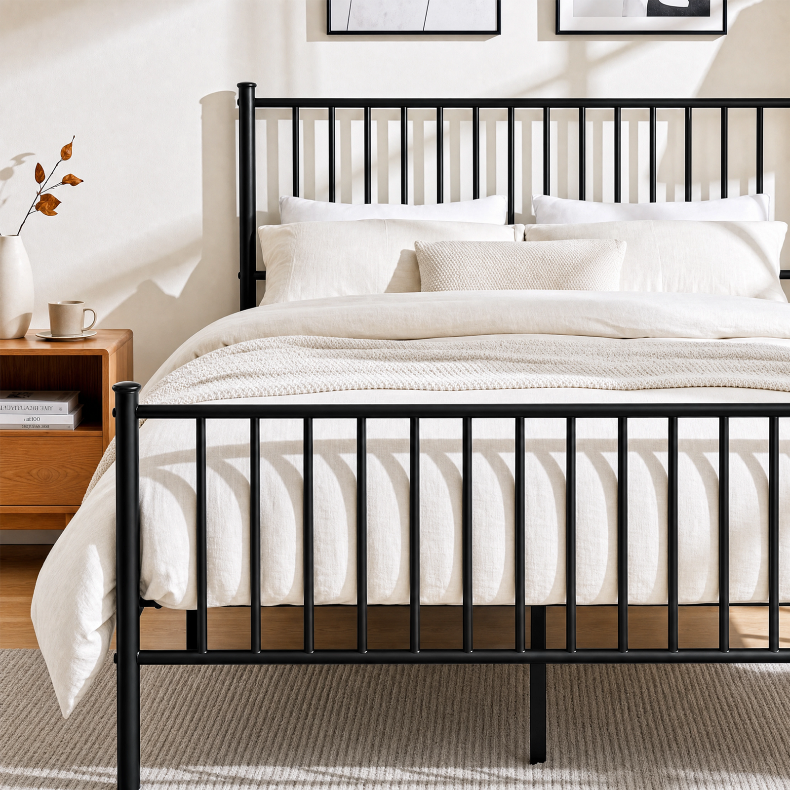 [Black | Double] Metal bed front close-up view of vertical bar footboard, tall headboard, cream bedding & centre support leg.