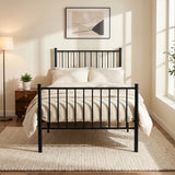 [Black | Single] Front view of metal bed with cream-white bedding, bar ends, centre leg, bedside plant, lamp & bright window.