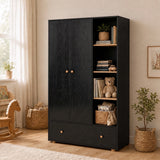 [Black] Wardrobe side angle in nursery with closed doors, open shelving, drawer, teddy bear, basket, plant, and sunlight.