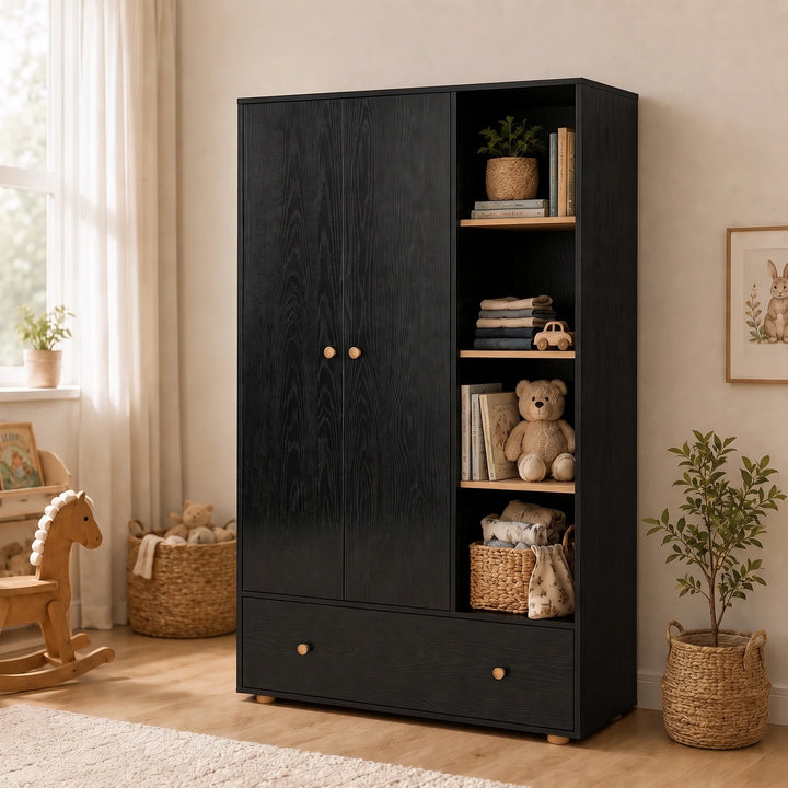 [Black] Wardrobe side angle in nursery with closed doors, open shelving, drawer, teddy bear, basket, plant, and sunlight.