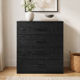 [Black] Front view of a black wood grain 4-drawer chest with sleek black handles, styled with vase decor on a wooden floor