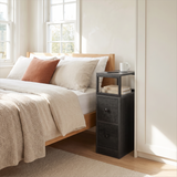 [Wooden Dark Grey] Narrow side table with storage beside a bed, holding a lamp and small bedroom essentials