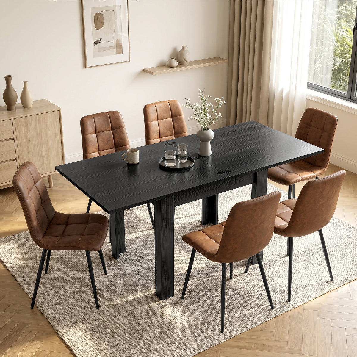 [Black] Extended flip-top dining table with six brown chairs, cup, glasses and flower vase in a bright dining room
