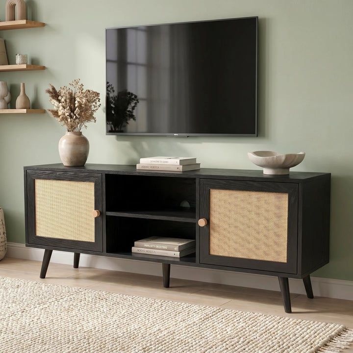 [Black] Wovena Black Rattan TV Unit with 2 Door Storage 140cm three-quarter view in sage green living room showing rattan door panels and open centre shelving