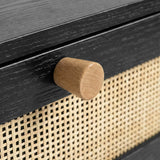 [Black] Wovena bedside table close-up showing rattan cane weave against black body