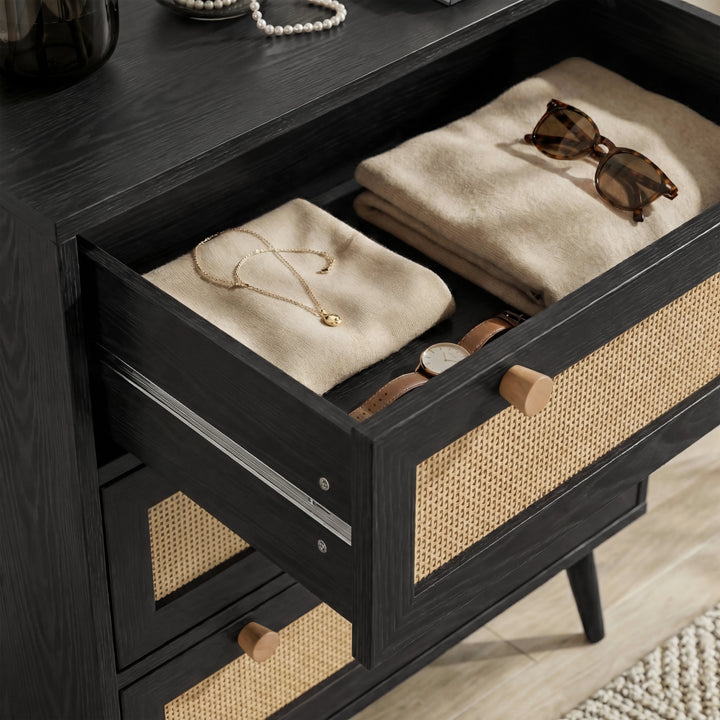[Black] Close detail of Wovena rattan bedroom furniture set chest drawer with knitwear, gold chain and sunglasses