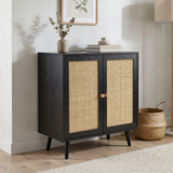 [Black] Rattan sideboard in a warm living room corner with eucalyptus stems, books and a wicker basket