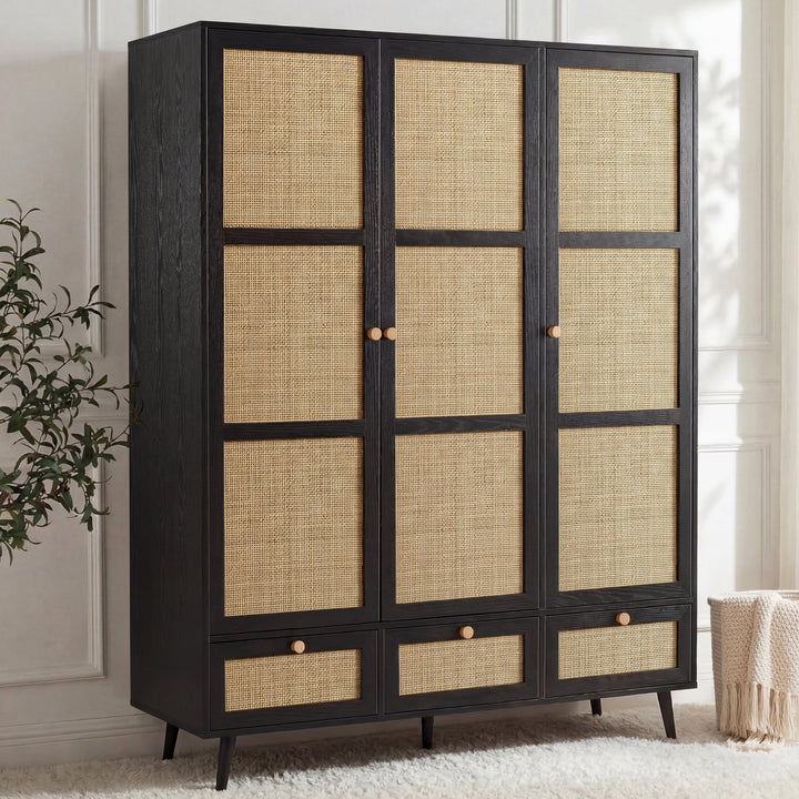 [Black] Three-quarter angle of the black rattan wardrobe with three doors, three base drawers and pine knob handles