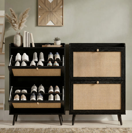 [Black] Wovena shoe cabinet shown side by side, left unit open displaying trainers on internal shelves and right unit closed with rattan panel doors in hallway