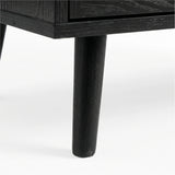 [Black] Wovena rattan TV unit leg macro, splayed black timber leg under the dark melamine cabinet edge