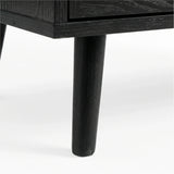 [Black] Wovena rattan TV unit leg macro, splayed black timber leg under the dark melamine cabinet edge