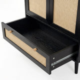 [Black] Wovena rattan wardrobe drawer close-up: rattan-fronted pull-out at the base with wooden knobs and runner