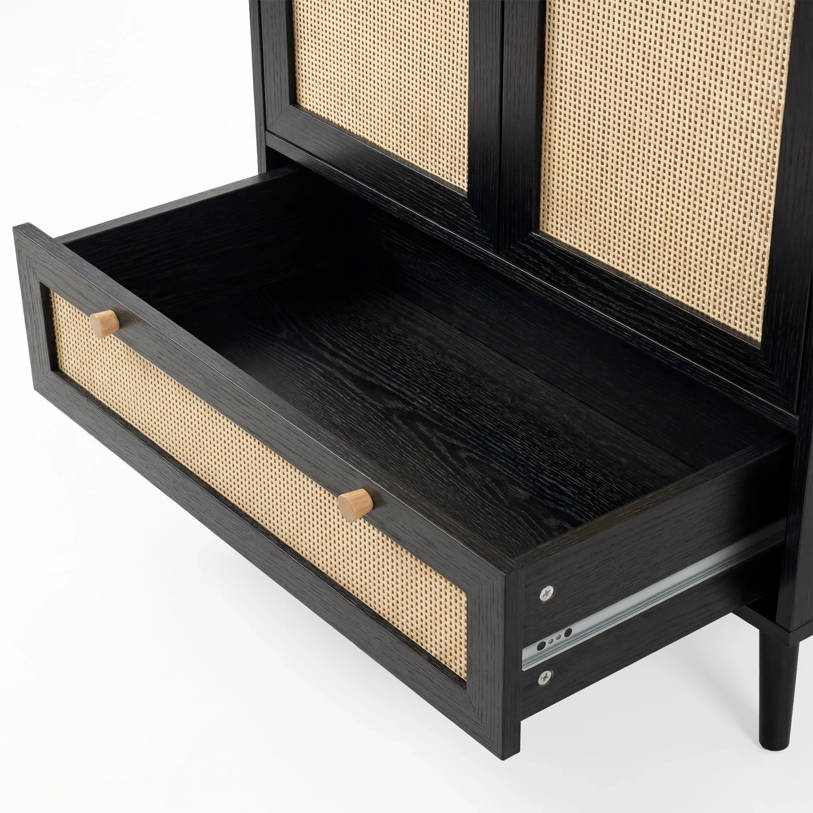 [Black] Wovena rattan wardrobe drawer close-up: rattan-fronted pull-out at the base with wooden knobs and runner