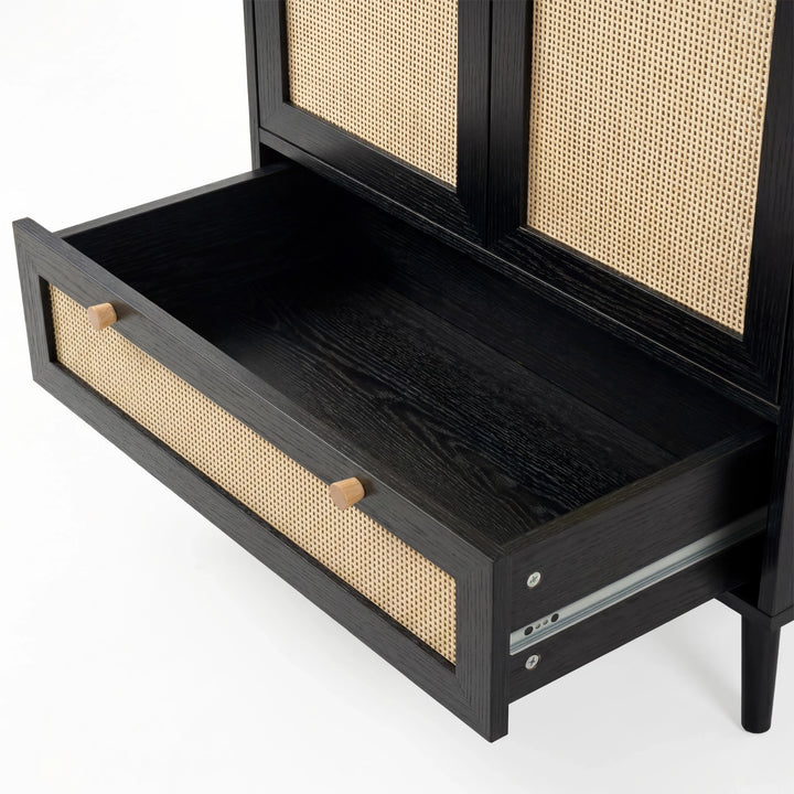 [Black] Wovena rattan wardrobe drawer close-up: rattan-fronted pull-out at the base with wooden knobs and runner