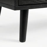 [Black] Underside corner of the black rattan wardrobe showing a single round splayed leg lifting the cabinet