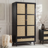 [Black] Wovena wardrobe three-quarter angle showing rattan door panels and tapered legs in a styled bedroom
