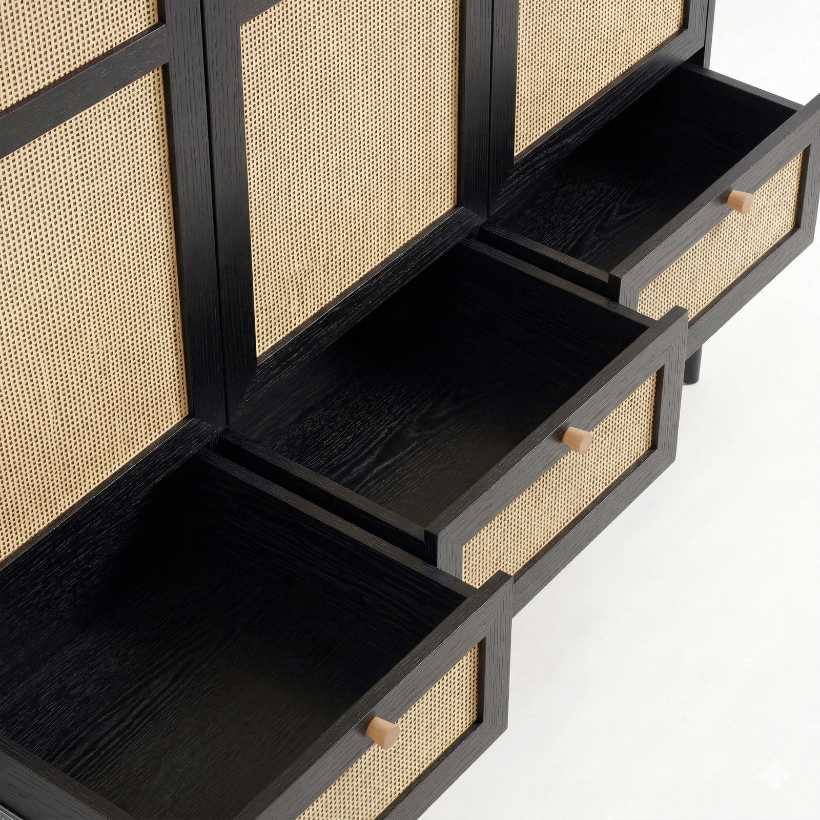 [Black] Three base drawers of the black rattan wardrobe pulled fully open showing empty interiors and pine knob handles