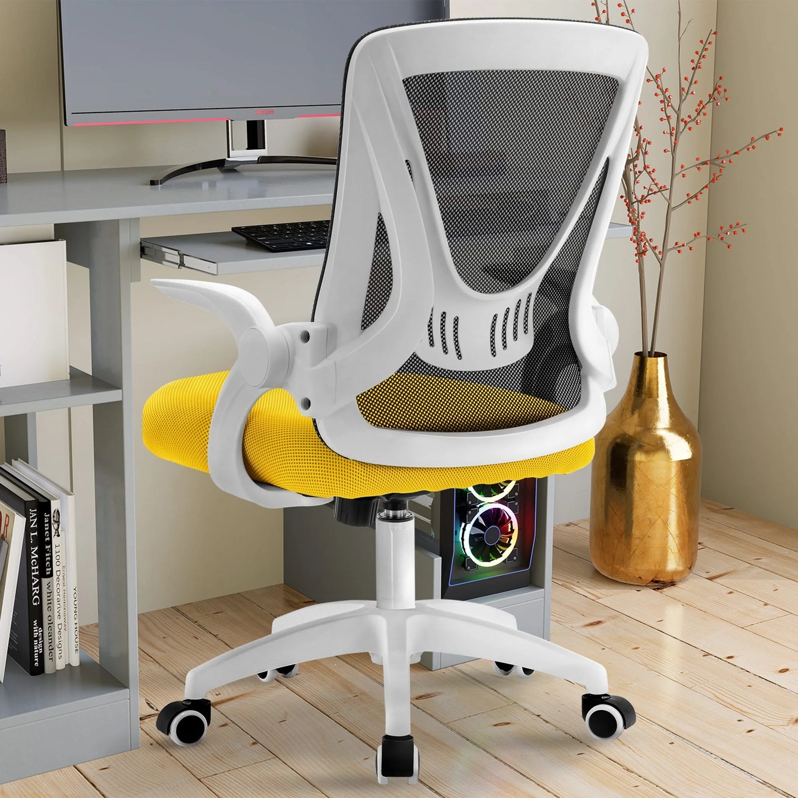 [Black + Yellow] Black and yellow comfy desk chair with breathable mesh backrest, perfect for use at a workstation.