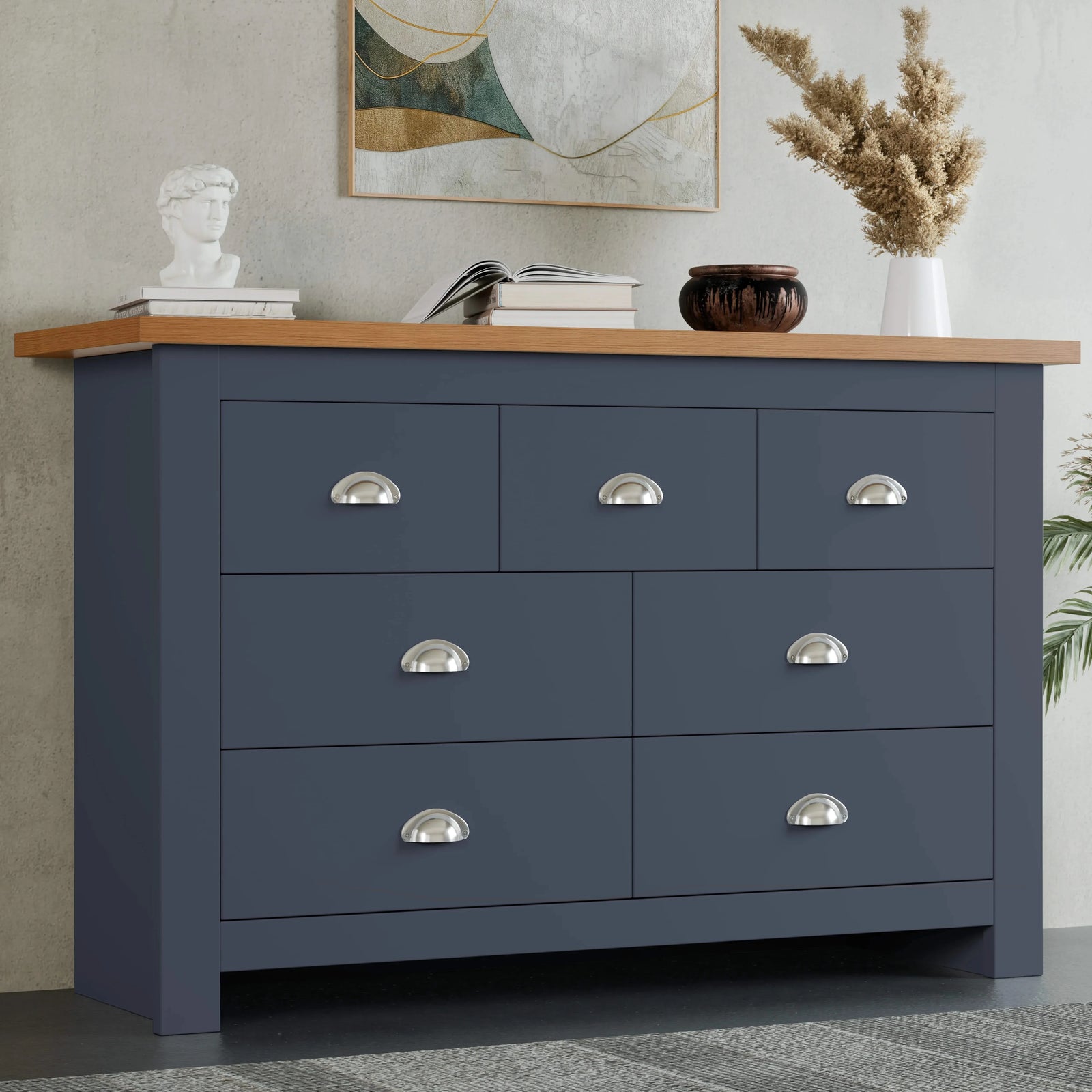 [Blue] Shaker 7 drawer wide chest front view with oak top and pampas grass in vase on top.