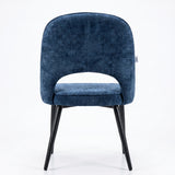 [Blue | Set of 4] Rear view of the comfy dining chair with rounded open back, piped seat and four sturdy black metal legs.