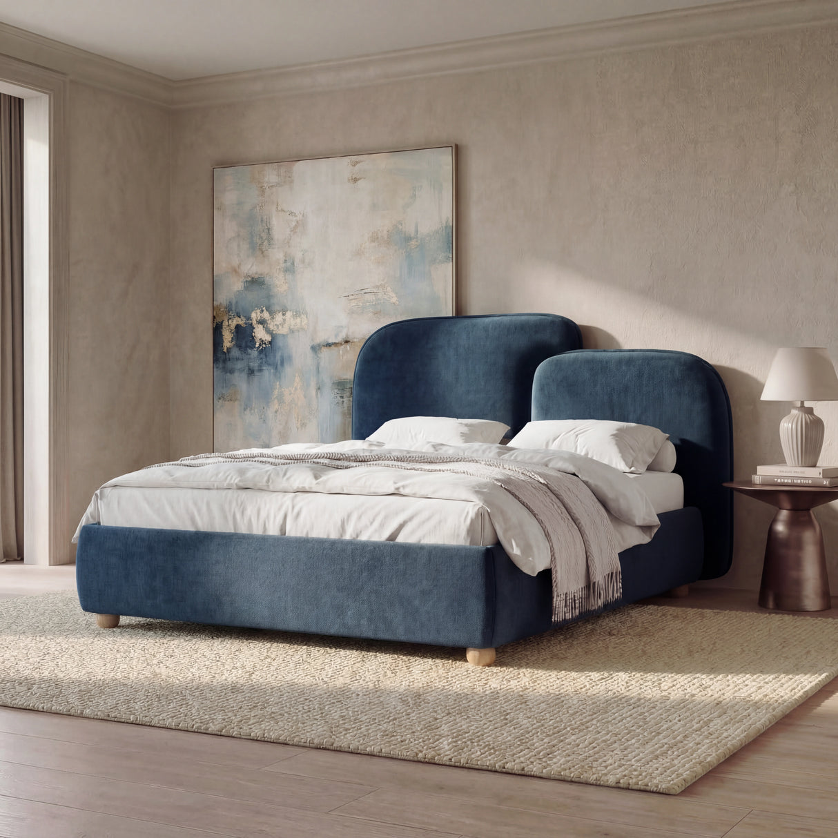 [King | Blue] Side-angle view of a blue fabric king bed, highlighting the low profile base and soft upholstered frame