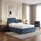 [King | Blue] Side-angle view of a blue fabric king bed, highlighting the low profile base and soft upholstered frame