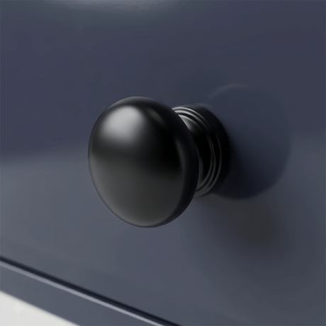 [Blue] Haven chest detail showing a matte black rounded drawer knob set against the deep navy blue painted drawer front