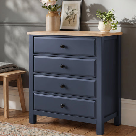 [Blue] Haven 4 drawer chest with oak top and dark knobs shown at a three-quarter angle against a soft grey wall