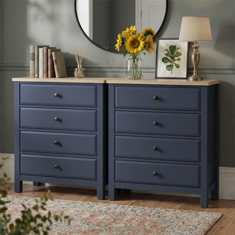 [Blue] Haven 4 drawer chest shown as a matching pair side by side, styled with sunflowers, a lamp and round mirror