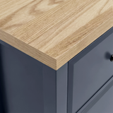 [Blue] Haven close-up of natural oak top surface showing wood grain texture against navy blue painted body