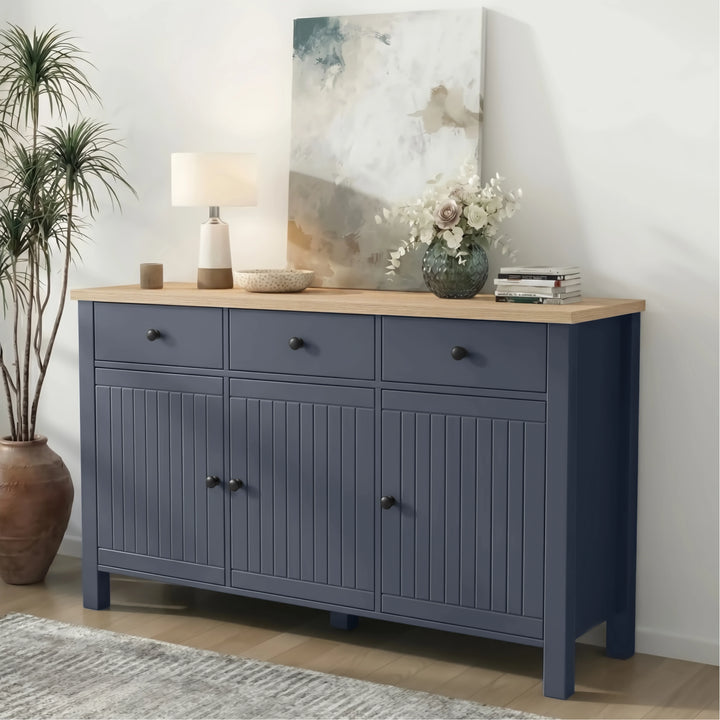 [Blue] 3 door sideboard with wooden top in a room setting with decor items