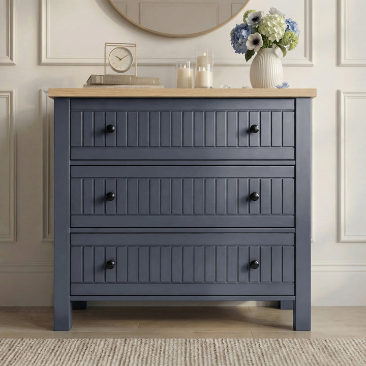 [Blue] Blue 3 drawer chest from Linra bedroom furniture set with oak top, clock and hydrangea vase styled on top