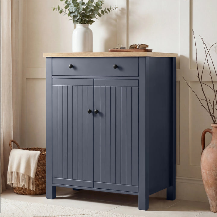 [Blue] Linra shoe storage cabinet in navy with oak top, top drawer with round knobs, and beadboard double-door cupboard below