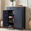 [Blue] Linra shoe cabinet with left door open showing four shelves holding heels, trainers, and boots in a warm hallway