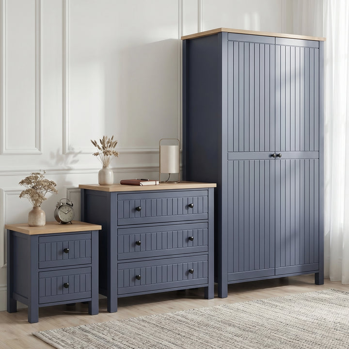 [Blue] Linra bedroom furniture set with 2 door wardrobe, 3 drawer chest and 2 drawer bedside in panelled room