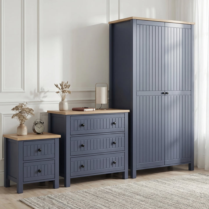 [Blue] Linra bedroom furniture set with 2 door wardrobe, 3 drawer chest and 2 drawer bedside in panelled room