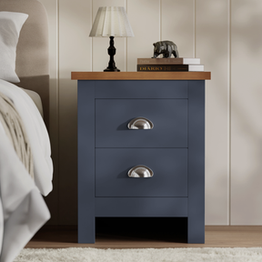 [Blue] blue shaker bedside table styled with table lamp and bear ornament on oak top in panelled bedroom
